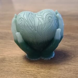 Artistic Green Hands Holding Heart